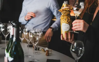 A refined gathering with people enjoying a champagne tasting in Aÿ-Champagne, France.