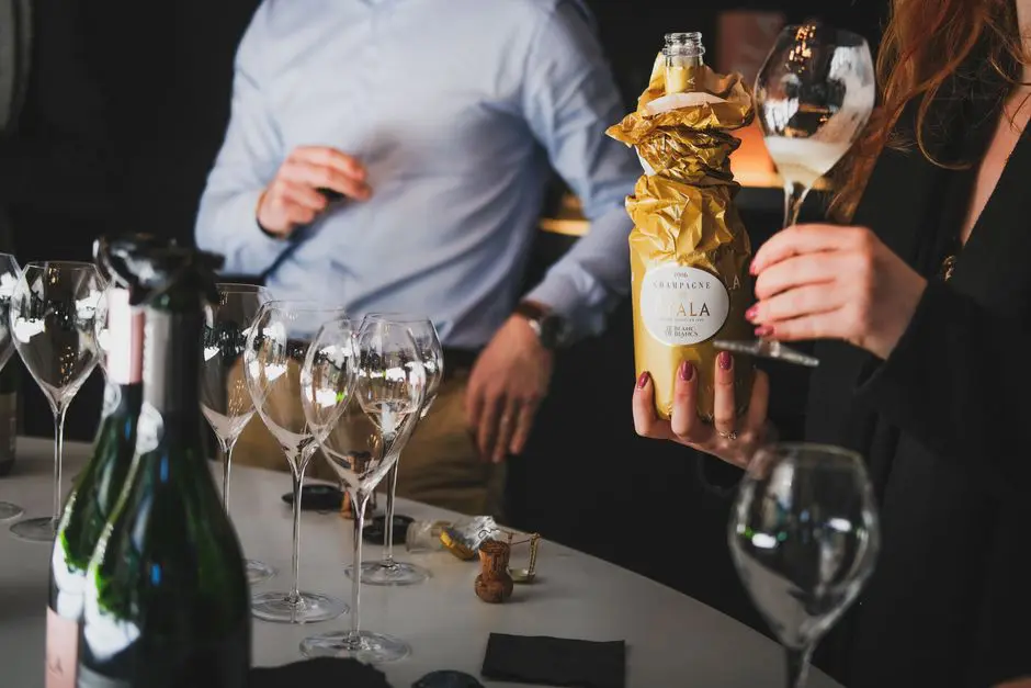 A refined gathering with people enjoying a champagne tasting in Aÿ-Champagne, France.