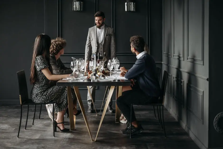 A sophisticated wine tasting event with diverse adults enjoying drinks indoors.